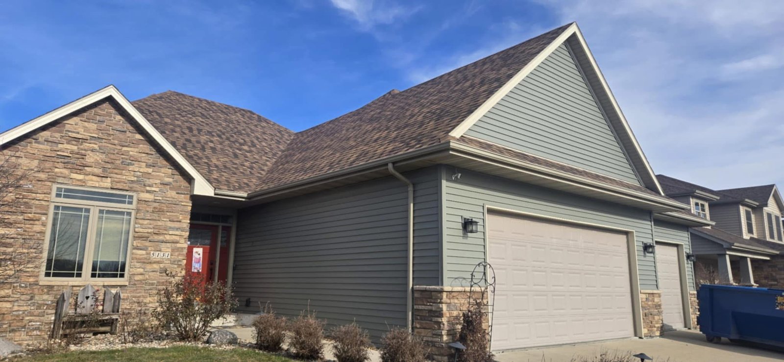 Hutch Unlimited roofing work on a home near Polk City, Iowa