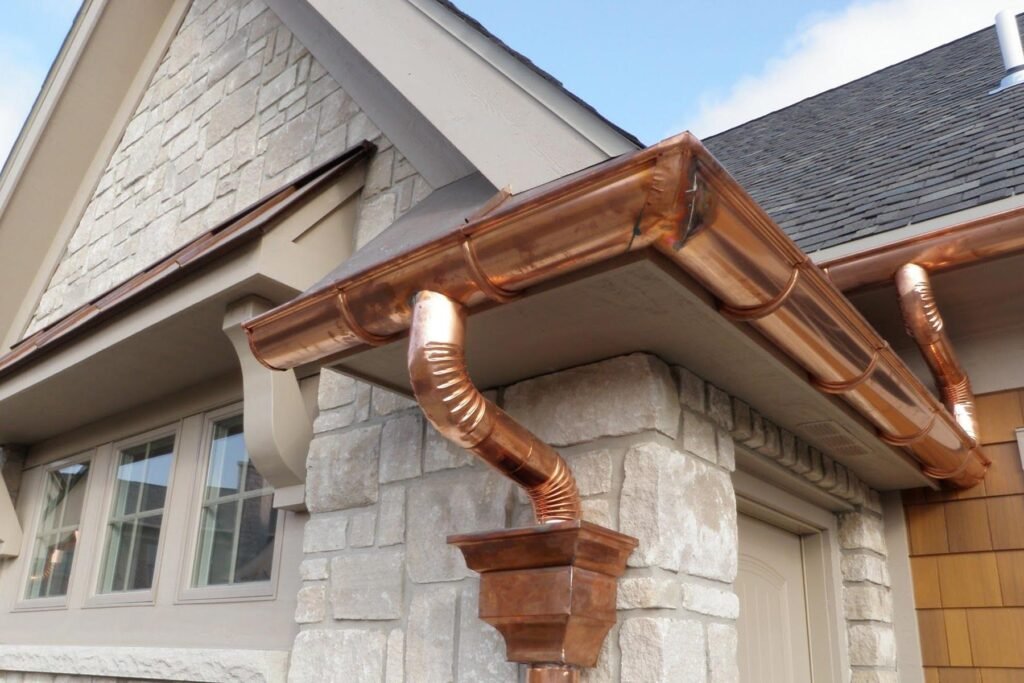 Close-up of seamless gutter installation on a Central Iowa home