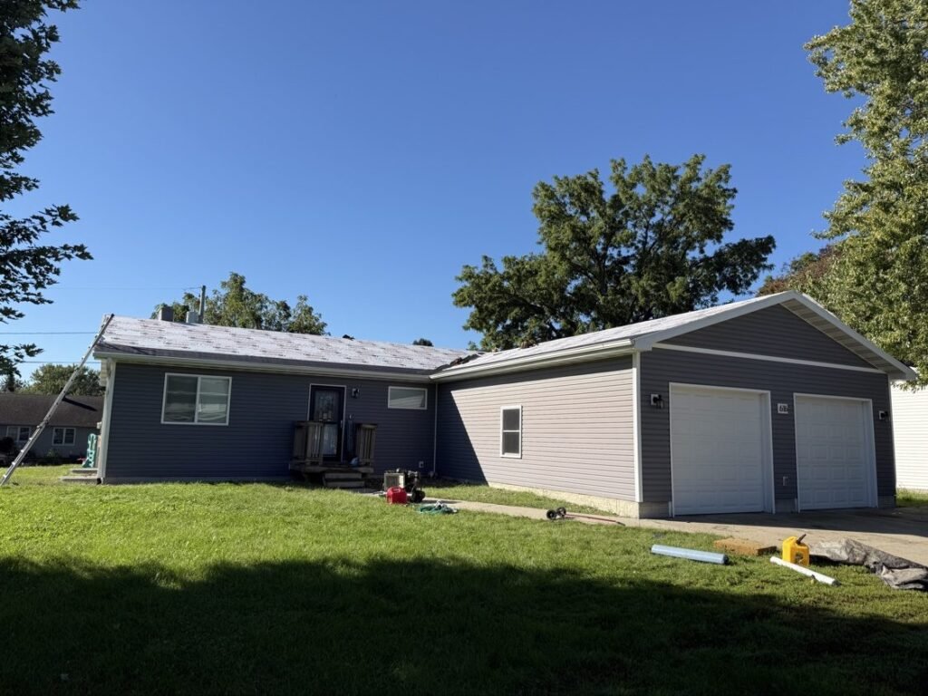 Roof replacement in progress with synthetic underlayment installed on a ranch home by Hutch Unlimited Roofing