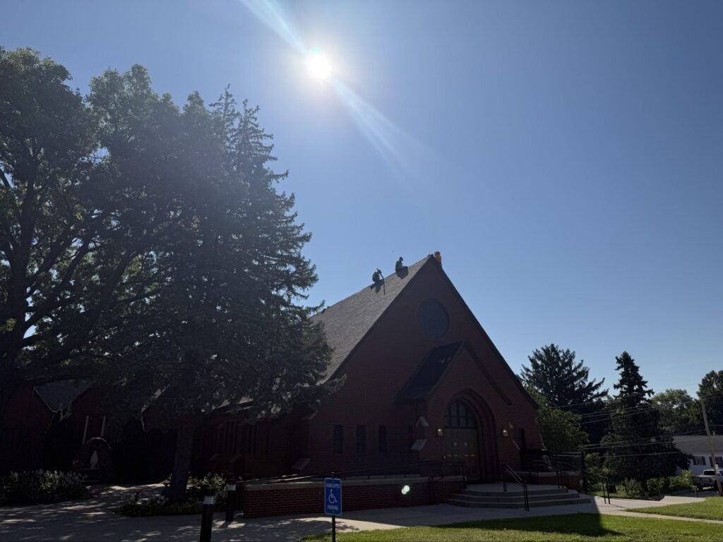 Hutch Unlimited Roofing crew on a church roof replacement, Iowa