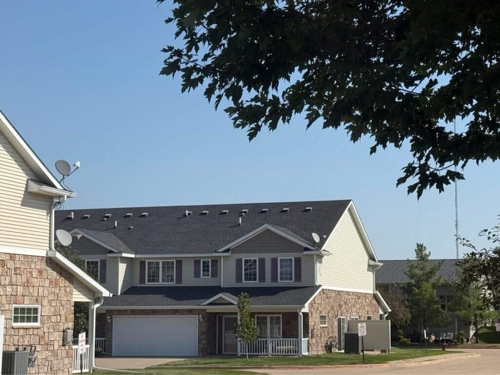 Completed shingle roof on a two-story home by Hutch Unlimited Roofing, Iowa