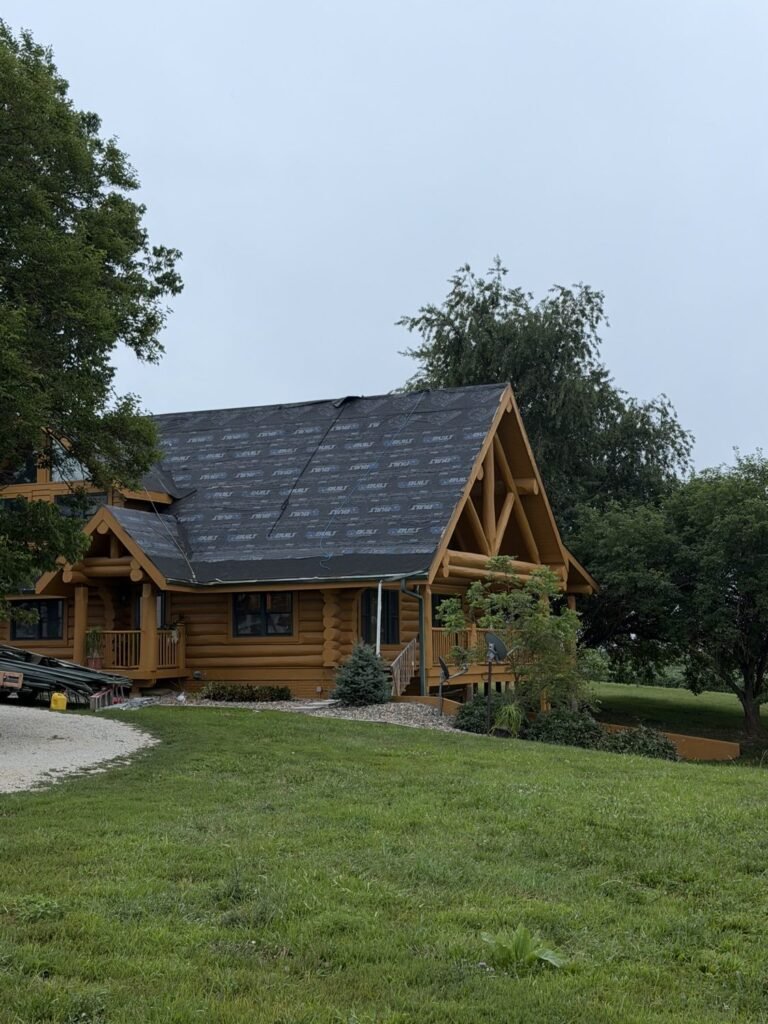 Log cabin roof during replacement with underlayment installed, Hutch Unlimited Roofing Iowa
