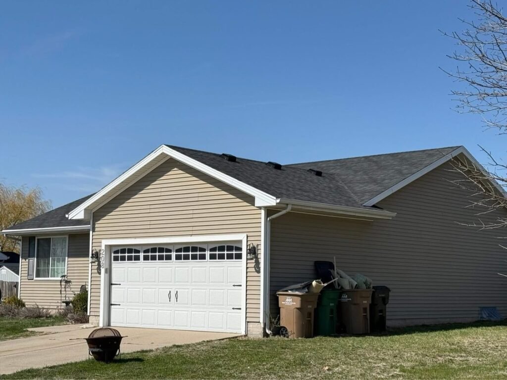 New shingle roof viewed from the garage side by Hutch Unlimited Roofing, Iowa