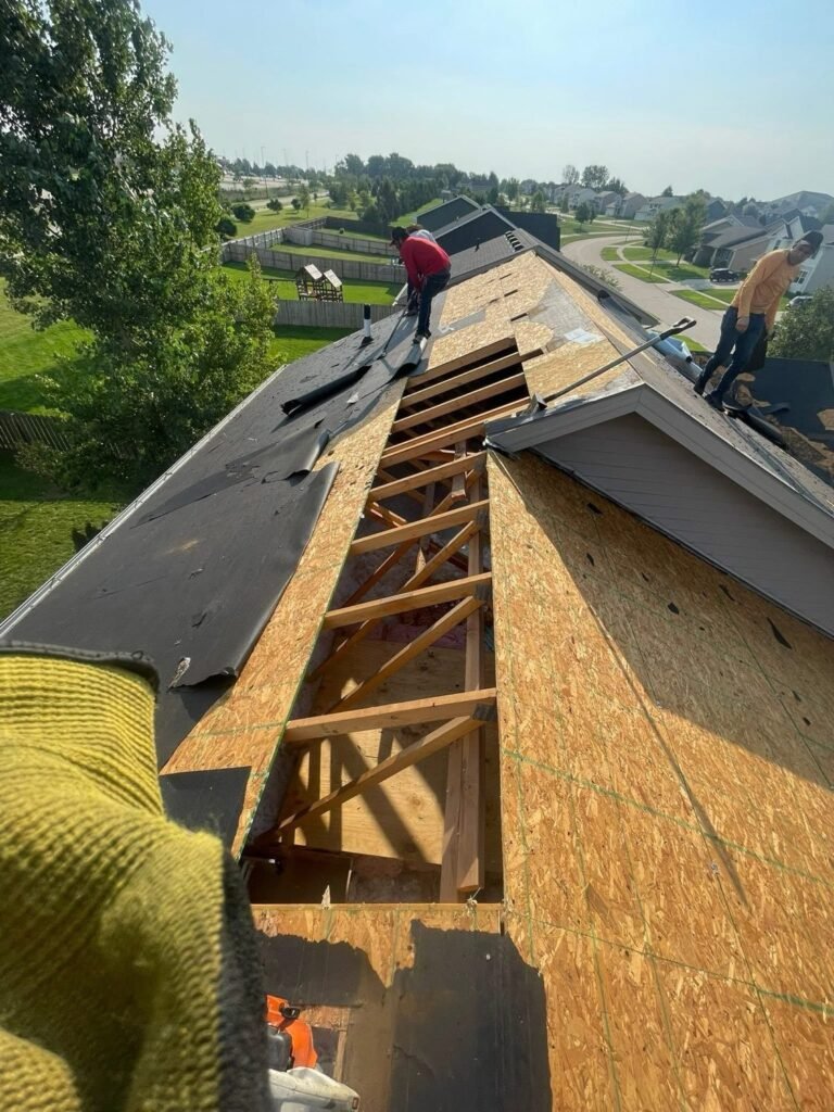 Roof deck replacement with exposed trusses during a tear-off by Hutch Unlimited Roofing, Iowa