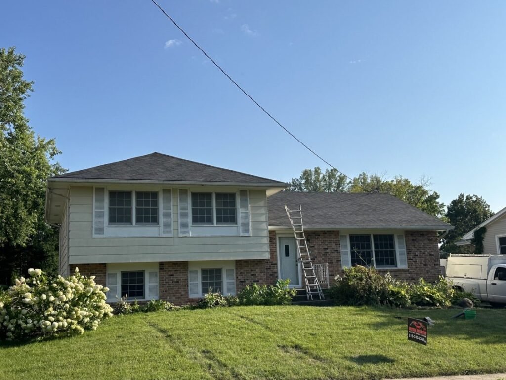 Completed shingle roof on a split-level home by Hutch Unlimited Roofing, Iowa