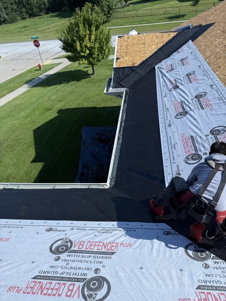 Close-up of ice-and-water underlayment installation at the roof eave by Hutch Unlimited Roofing, Central Iowa