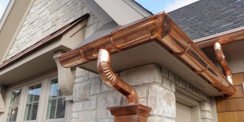 Close-up of seamless gutter installation on a Central Iowa home